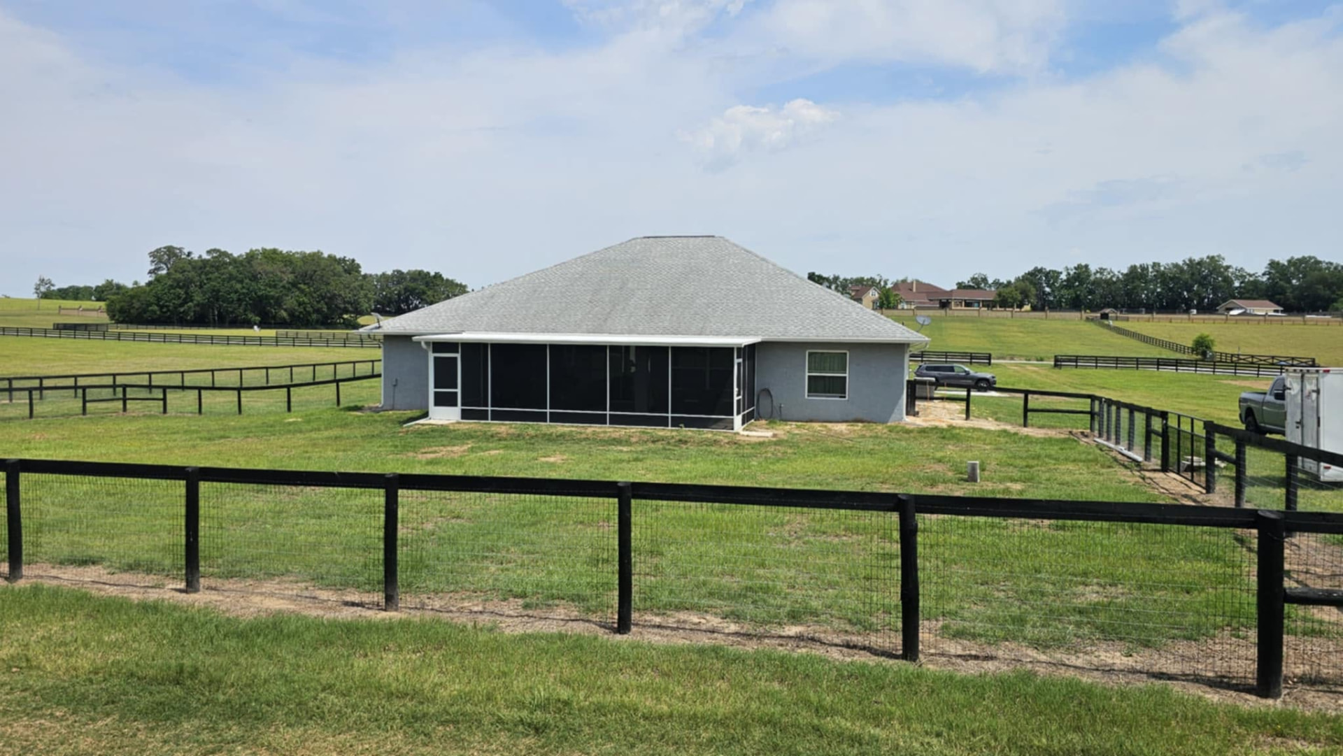 Screened porch on a ranch home overlooking pasture