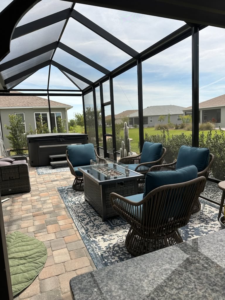 Screened lanai with fire table and hot tub